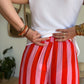 Pantalon fluide rayé orange et rose