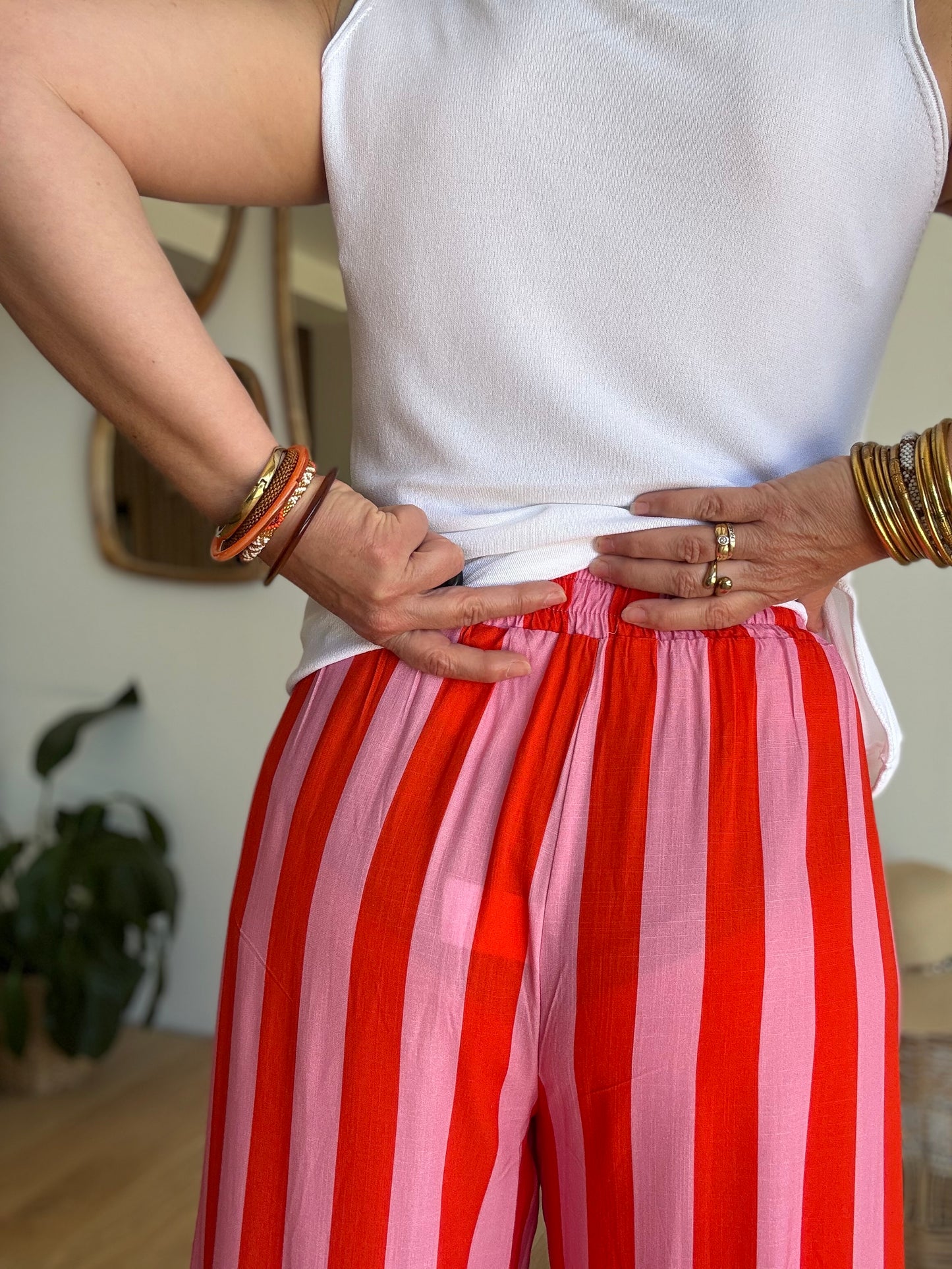 Pantalon fluide rayé orange et rose