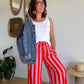 Pantalon fluide rayé orange et rose